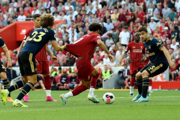 Mohamed Salah wins a penalty against Arsenal at Anfield